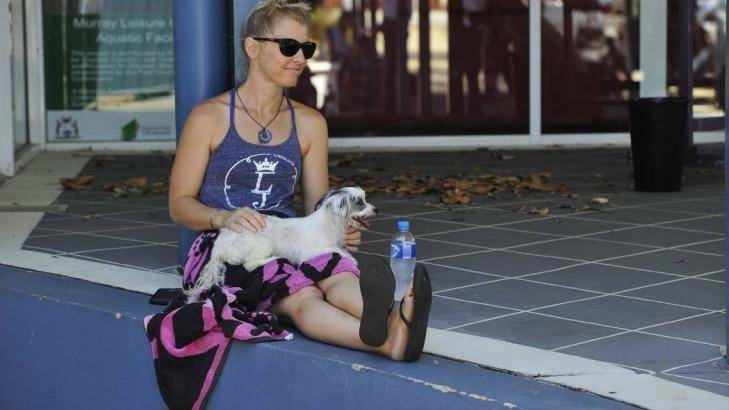 Melissa Young and her puppy Maisie were happy to have escaped Waroona. Photo: Richard Polden
