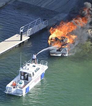 Firefighters estimate the Woodman Point fire caused $100,000 damage to the boat and jetty. Photo: Surf Life Saving WA