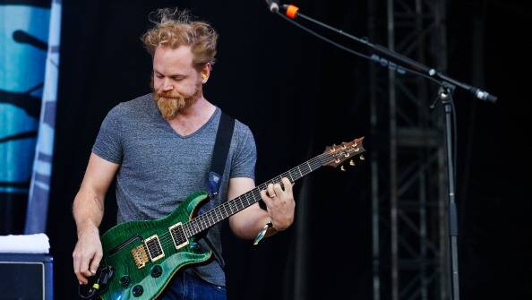 Mark Hosking performs with Karnivool on stage on Day 2 of Download Festival 2013 at Donnington Park in Donnington, England. Photo: Getty Images.