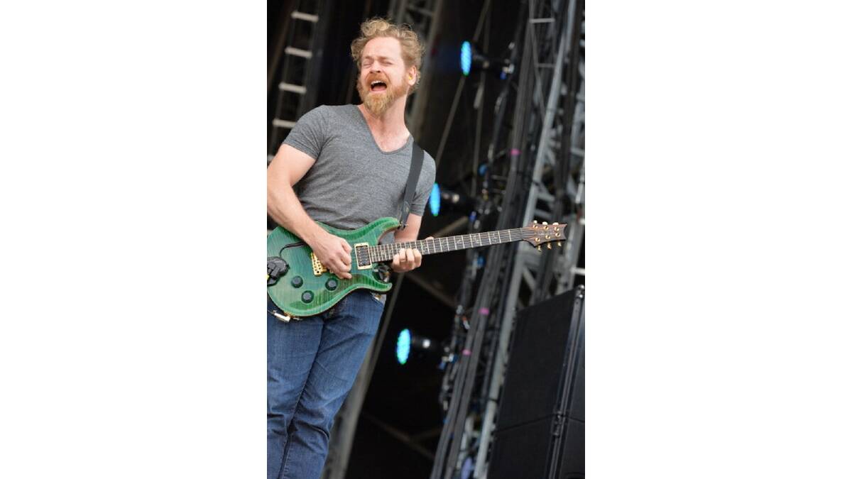 Mark Hosking performs with Karnivool on stage on Day 2 of Download Festival 2013 at Donnington Park in Donnington, England. Photo: Getty Images.
