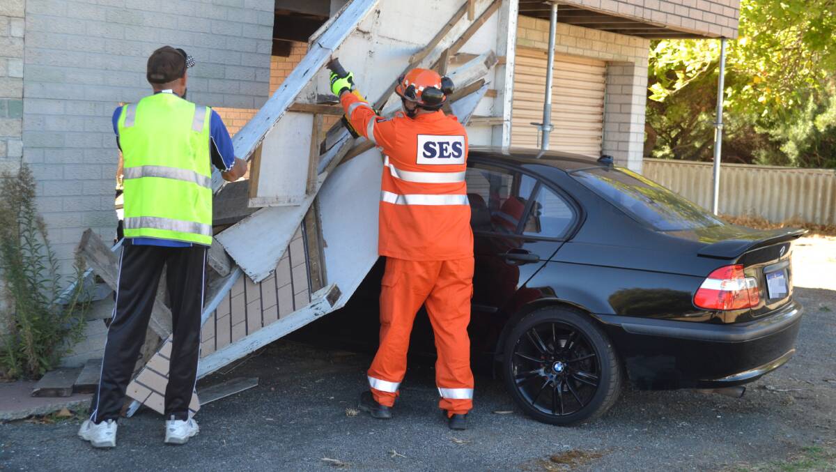 The car was removed from the Halls Head house on Monday morning. (Photo: Brianna Johnson)