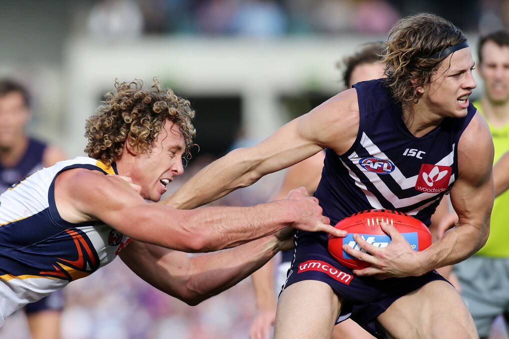 Matt Priddis (left) will take on Nat Fyfe in a match-up of two of the league's most formidable midfielders this Saturday. Photo: Getty Images.