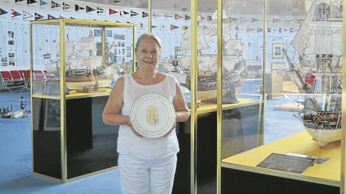 Preparing to close: Kerry Tasker with the Melbourne Olympic plate.