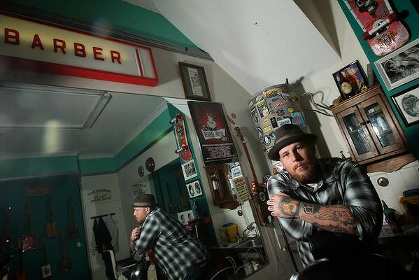 Barber Tommy J in his salon Guys and Dolls, Redfern. Photo Danielle Smith