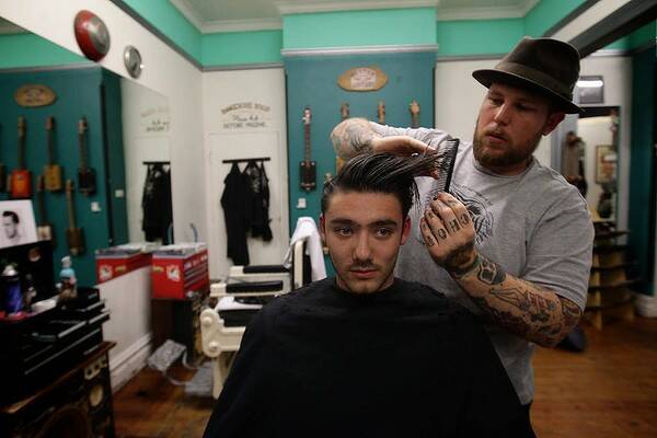 Guys and Dolls Redfern, Hairdresser Tommy J with client Jason Gunning age 18. Photo Danielle Smith