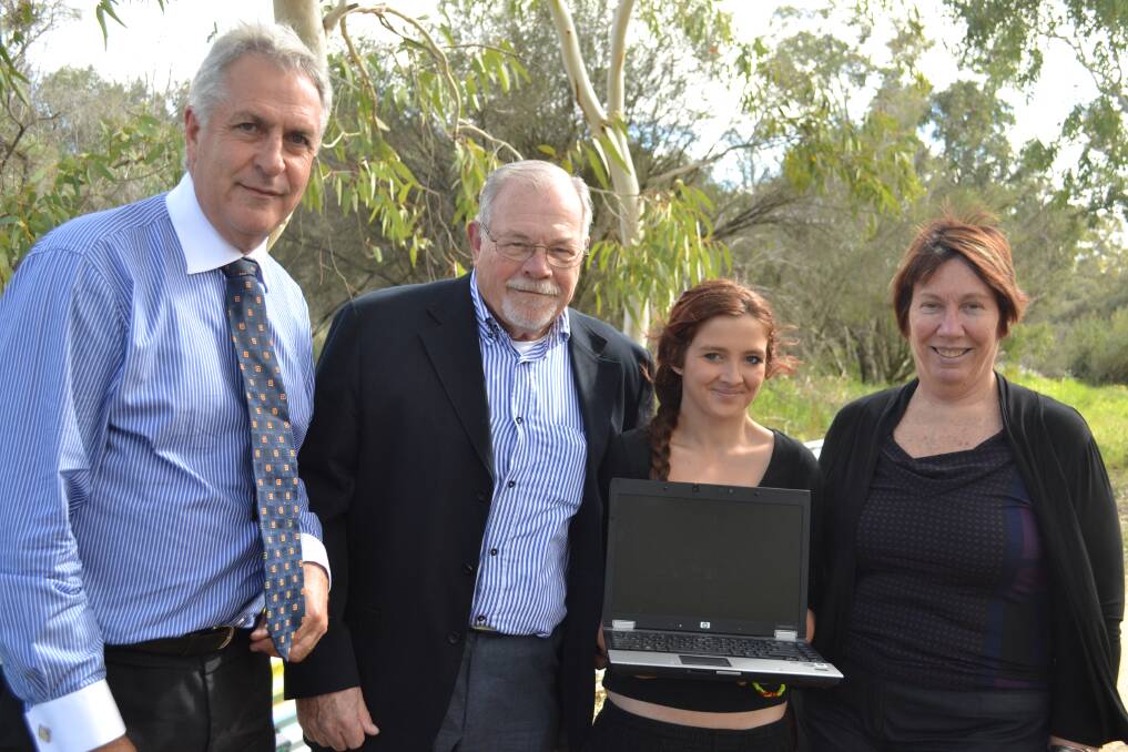 MHR Don Randal, Phil Gray and senator Sue Lines with Maddi Hamilton who received the 6000th donated computer from Mandurah Muscateers.