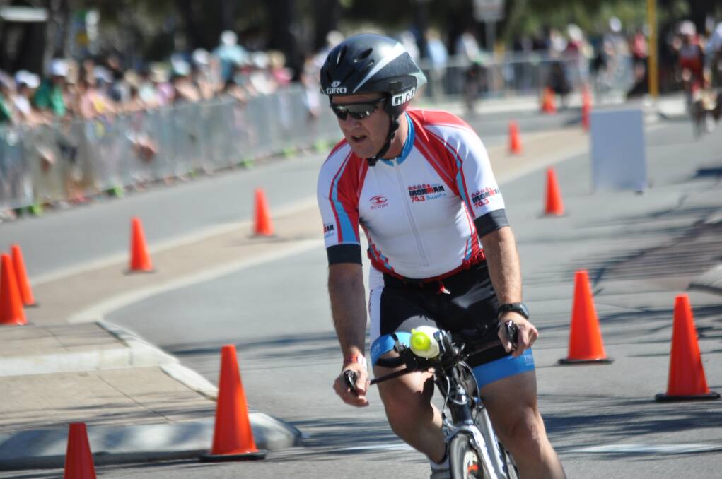A MASSIVE crowd took to local waterways and streets today for the Sunsmart Mandurah Ironman 70.3.