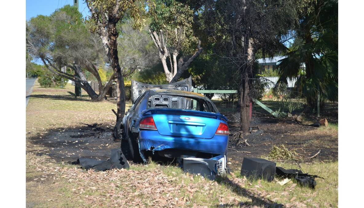 A car slammed into a tree in Coodanup last night, bursting into flames.