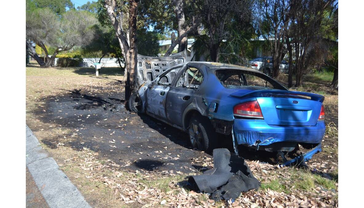 A car slammed into a tree in Coodanup last night, bursting into flames.