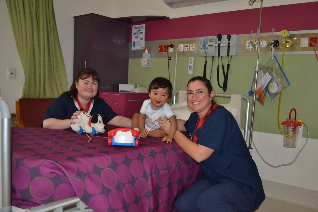 Lend a hand: Clinical Nurse Manager Wendy Singleton, 10-month-old Nathan Myint Soe and Clinical Nurse Specialist Debra Carruthers in the Peel Health Campus paediatric ward. 