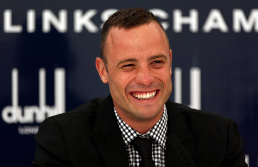 Oscar Pistorius talks to the media at his press conference during the practice round of The Alfred Dunhill Links Championship at The Old Course on October 3, 2012 in St Andrews, Scotland. Photo by Warren Little/Getty Images