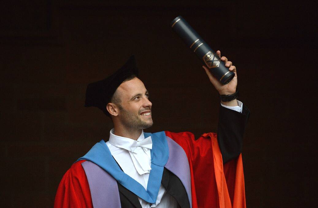 Oscar Pistorius, holds his scroll after receiveing his honorary doctorate from Strathclyde University in the Barony Hall on November 12, 2012 in Glasgow, United Kingdom. Photo by Jeff J Mitchell/Getty Images