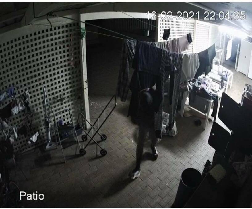 LURKER: security footage from Ms Chopra's garden that shows a man standing outside. Photo: Supplied.