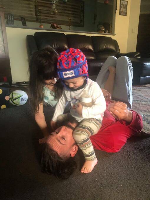 TAKE THAT: Saylah and Diaz show their dad Kade their best tackle. Photo: Supplied.