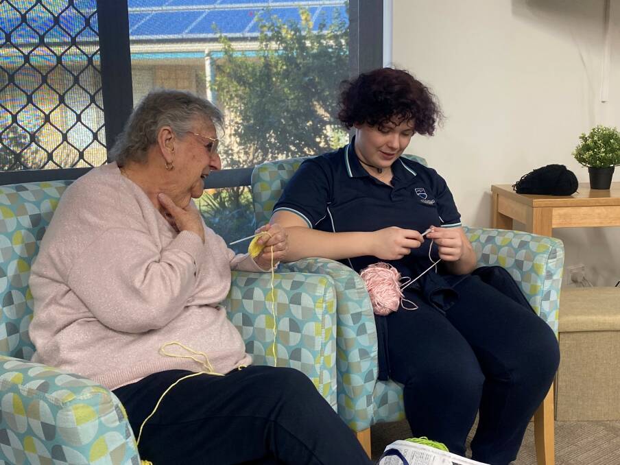 The students and lifestyle village residents crocheted together before sitting down for a delicious afternoon tea. Picture supplied.