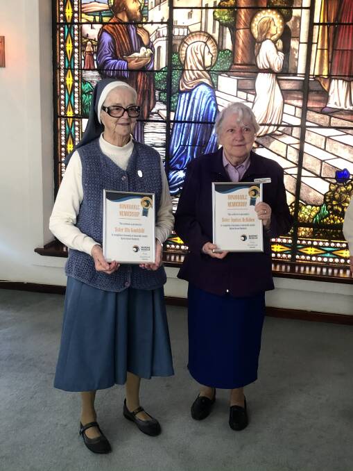 STRENGTH: Sister Rita Goodchild and Sister Augustine McMahon with their honorary lifetime memberships from the Marine Rescue. Photo: Supplied.