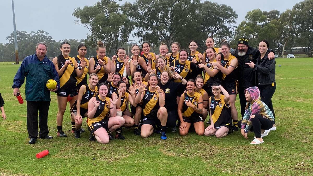 FAMILY: The Tigers posing after Jess's 50th game. Photo: Supplied.