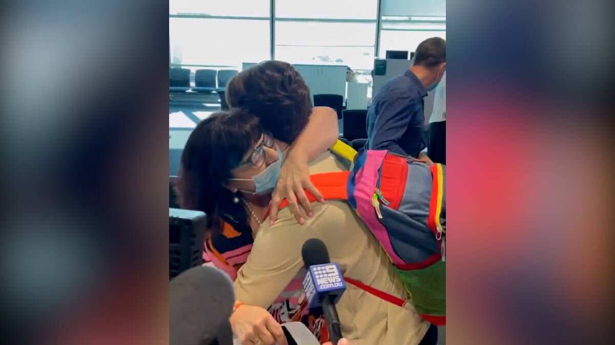 Families were reunited at Brisbane Airport on Monday. 