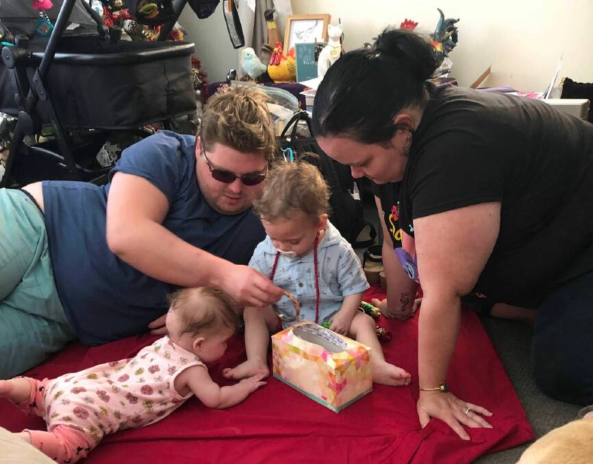 DOING THEIR BEST: Samantha Kate Penny with her fiance and two children. Her fiance has had to pick up overtime work to afford the rising grocery bill. Photo: Supplied.