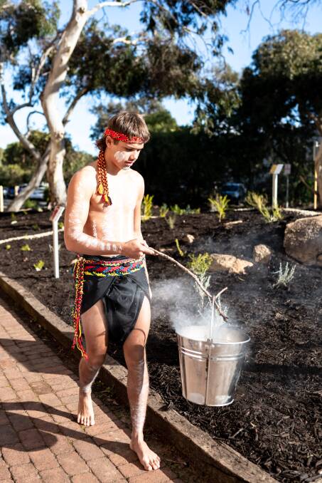CELEBRATION: Bindjareb Middar Cyallyutt Kearing performing a smoking ceremony and cleansing the new Noongar Six Seasons Garden. Picture: Supplied.