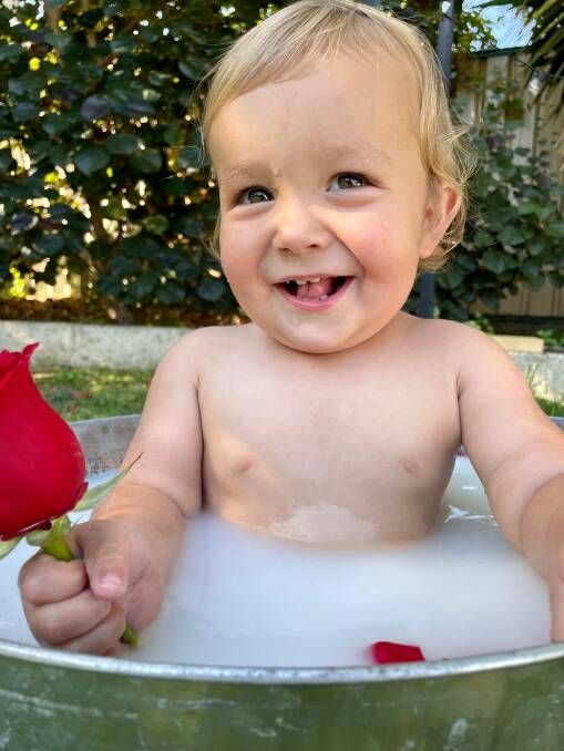 Young Charlie holding a rose for 65 Roses Day. Picture: Supplied