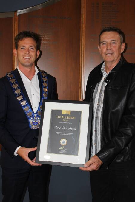 COMMUNITY CARE: Mayor Rhys Williams handing Pastor Hans van Asselt his local legend award, for his service to the community and church. Picture: Supplied.