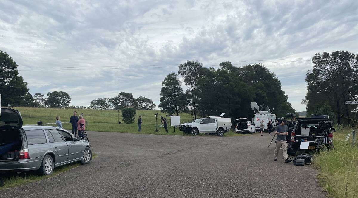 Police and media gathered at the intersection of Hazleton Road and Coolabah Road, Bungonia. Picture by Burney Wong