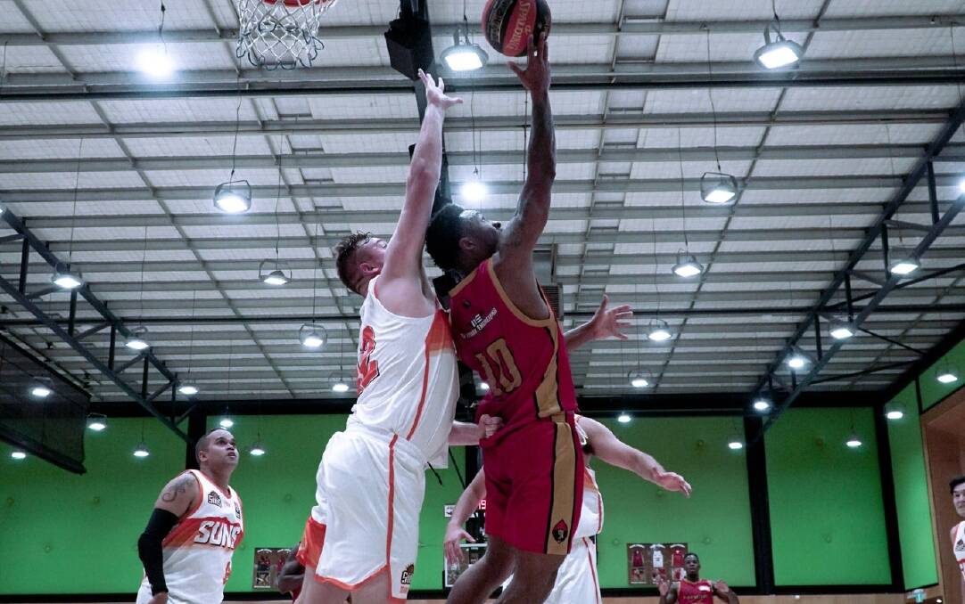 Dequan Abroms (red 10) returns to the Mandurah Magic for the 2023 NBL1 West season. Picture from Mandurah Basketball Association.