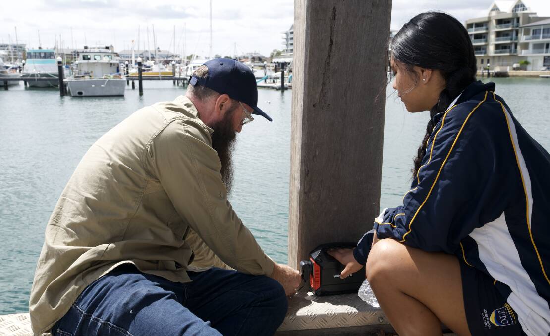 Dr Alan Cottingham with a student from John Tonkin College at Mandurah Ocean Marina launching the water monitoring project. Picture supplied.