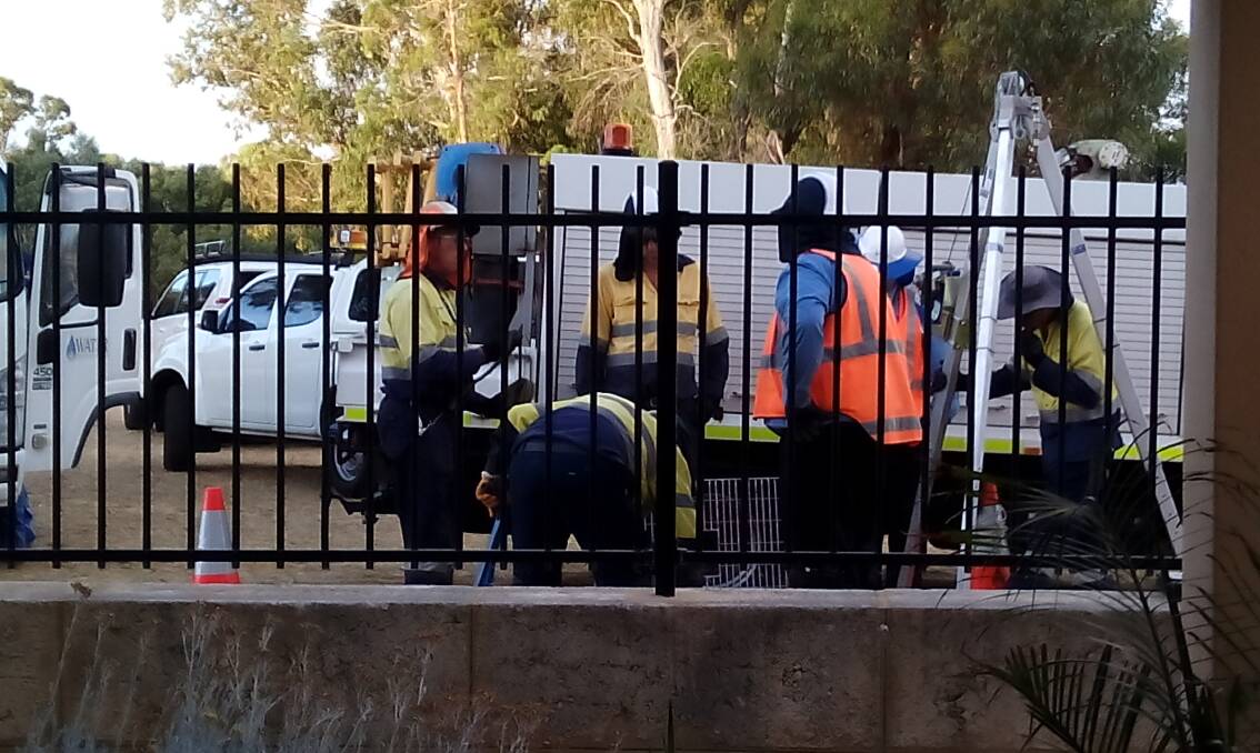 Water Corporation engineers work to fix the pumping station outside Mr Potrykus fence. Photo: Supplied.