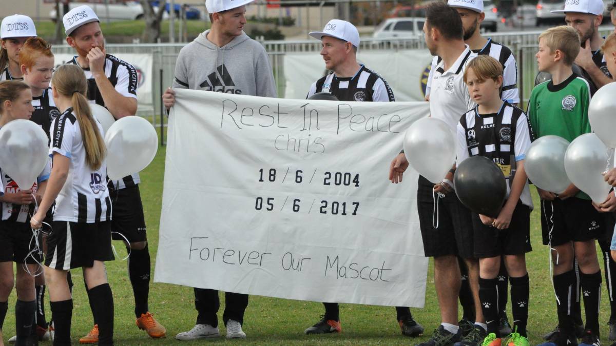 Moving: Mandurah City players giving a heartfelt farewell to club's biggest fan Christopher Chandler. Photo: Kate Hedley.