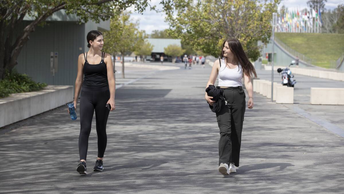 Social distancing: Rose Corcoran and Rosie Flannery getting some exercise. Picture: Sitthixay Ditthavong