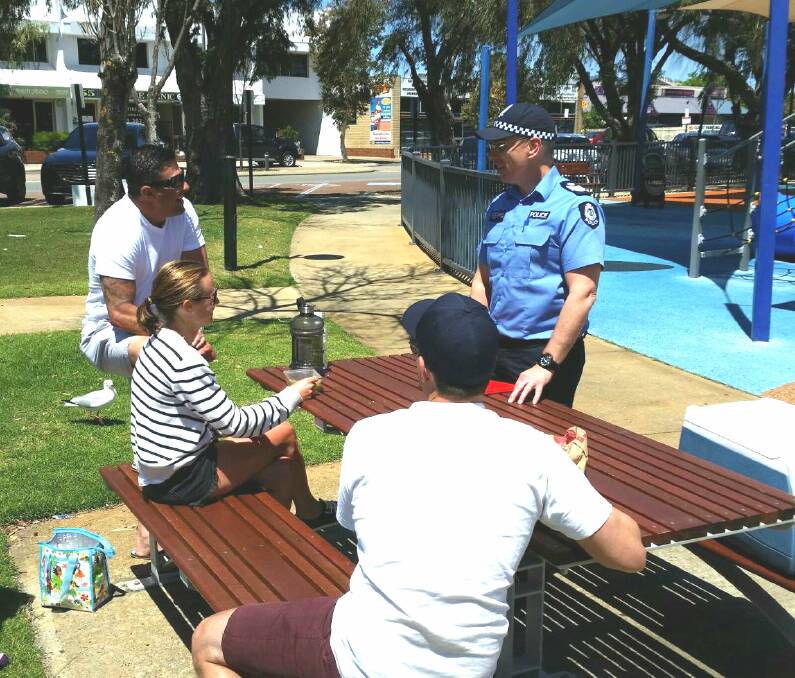 Community engagement: Mandurah Police Senior Sergeant Darren Hart talking with locals. Photo: Supplied. 