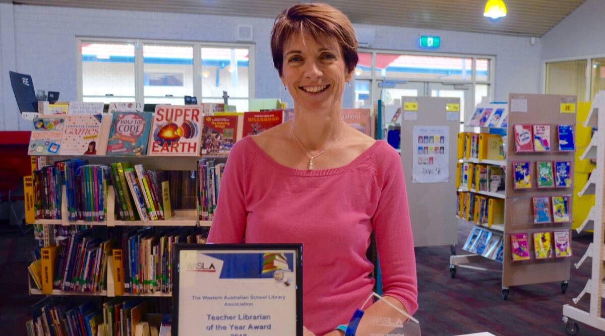Winner: Sarah Love with her Western Australian Teacher Librarian of the Year Award. Photo: Supplied. 