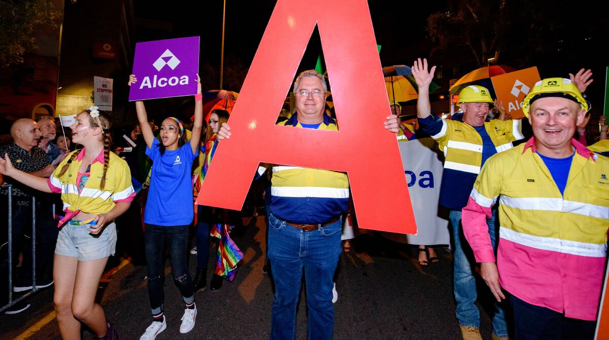 Accepting: Mark Hodgson leads the march for Alcoa in the 2017 WA Pride Parade. The company has marched for the last four years. Photo: Supplied. 