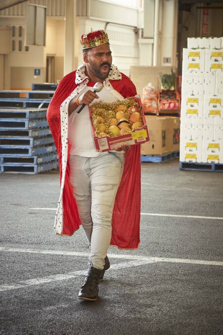 ROYALTY: Former Brisbane Broncos player, Sam Thaiday, makes a grand entrance with the mangoes. 