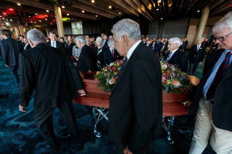 The coffin of Graham "Polly" Farmer is seen arriving for the State Funeral at Optus Stadium in Perth.