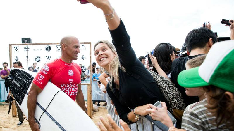 Kelly Slater greets fans after competing in the Vissla Sydney Surf Pro at Manly Beach, Sydney. Photo: Janie Barrett
