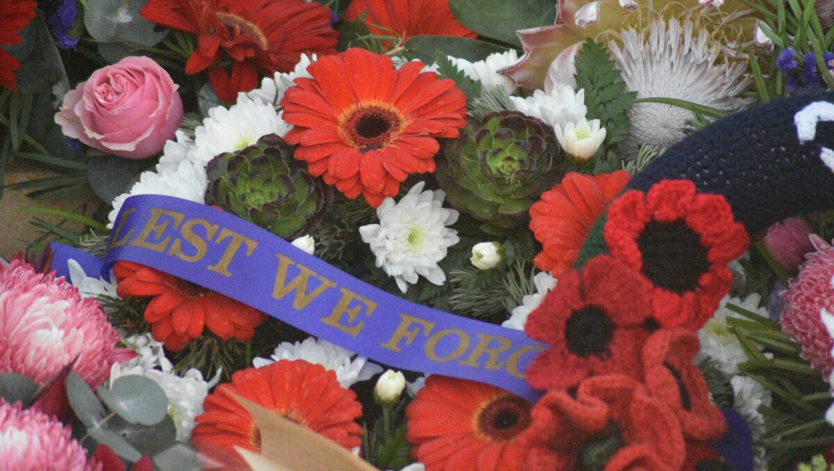 Lest We Forget on a wreath which was placed on the Dawesville War Memorial during proceedings.
