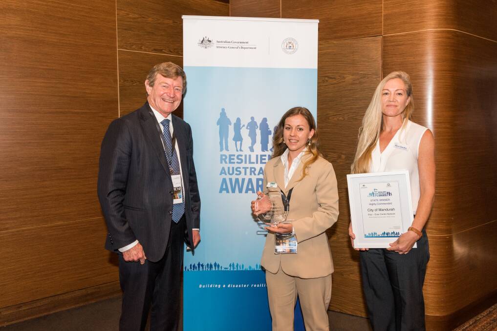State Emergency Management Committee chair Dr Ron Edwards, project officer Naomi
Dekker and City of Mandurah coordinator of emergency management Myra Giardini with the state award for the Equi - Evac Centre Network project. Photo: Supplied. 