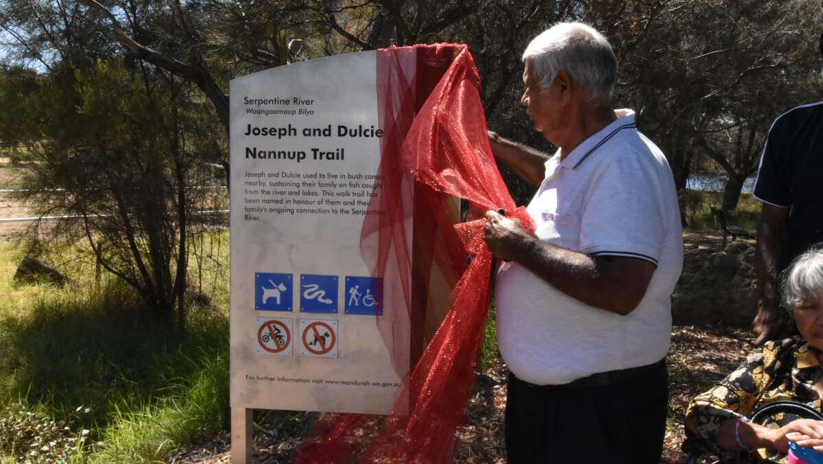 Harry Nannup unveiling the new sign for the Joseph and Dulcie Nannup Trail that's name has been endorsed by the Geographic Naming Committee. Photo: Caitlyn Rintoul.