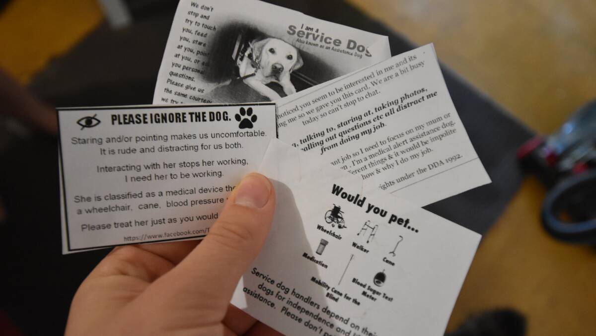 Some of the educational cards Ms May hands out to people who distract her dog while on duty. Photo: Caitlyn Rintoul. 