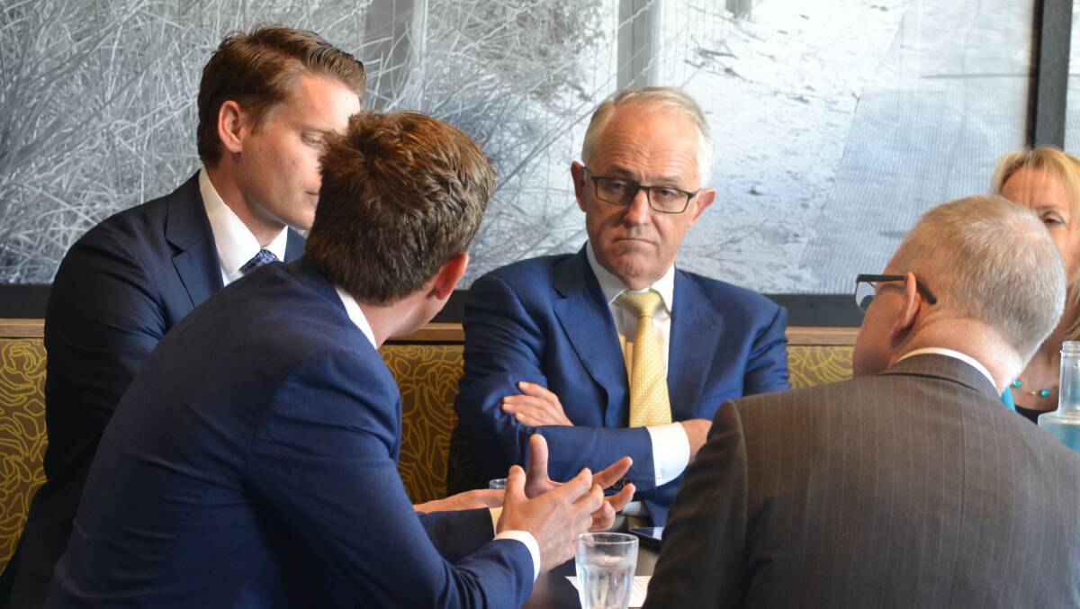 Prime Minister Malcolm Turnbull and Mandurah mayor Rhys Williams talking over coffee in Lakelands on Friday morning. Photo: Caitlyn Rintoul.