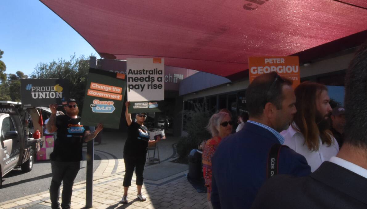 Photobombing: While One Nation leader Pauline Hanson hosted a press conference in Greenfields, several GetUp! volunteers stood behind the representatives and held up campaign posters.