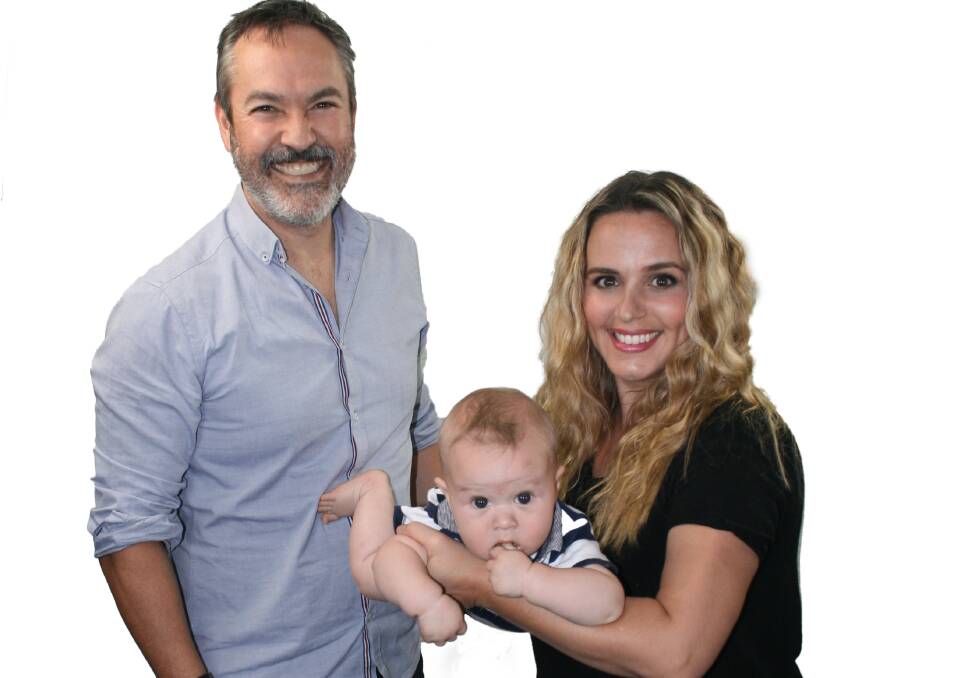 And baby makes three: 97.3 Coast FM's Gunners, Ali, and baby Seth. Photo: Supplied.