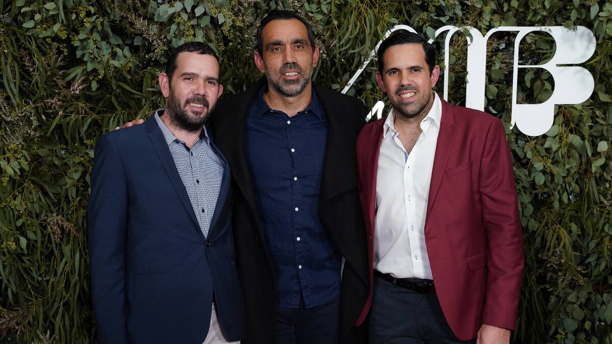 SPEAKING UP: Decorated Sydney Swan Adam Goodes flanked by his brothers Jake, from Stawell, and Brett, a former AFL Western Bulldog who plays football in Ballarat. Picture: AAP