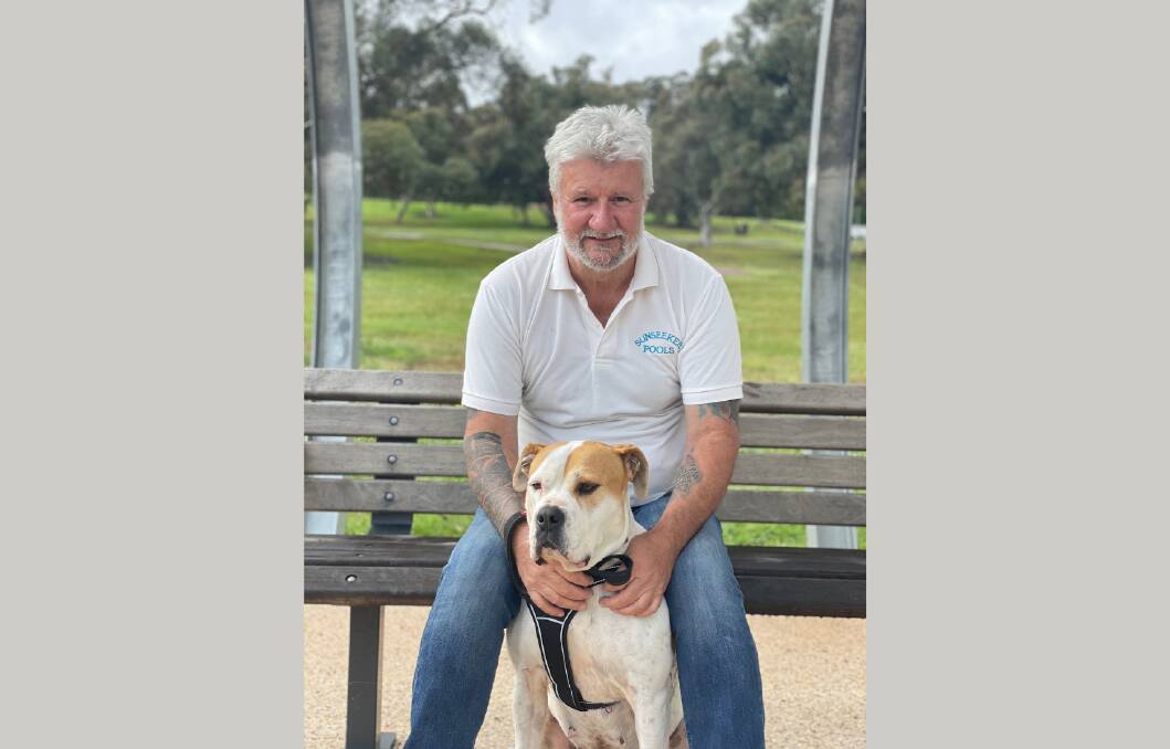 STAYING POSITIVE TOGETHER: Cancer survivor John Mills with his rescue dog, Charlie who is dying of cancer.