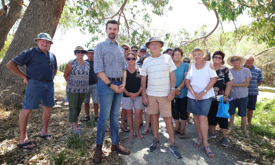 'Constant threat': Dawesville MP Zak Kirkup and Erskine residents are advocating for the government to clear excess fuel load at Len Howard Conservation Park before a bushfire occurs. Photo: Supplied.