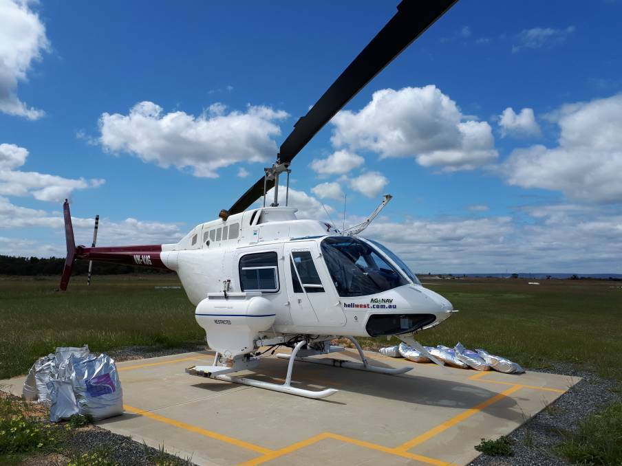Ramped up: A Peel Mosquito Management Group helicopter preparing to undertake an aerial mosquito treatment. Photo: Supplied.