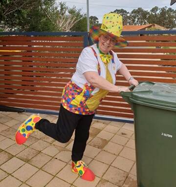 Mandurah volunteer, Kath Palmer has still managed to brighten up people's days while she is stuck in self-isolation with new costumes every bin outing. Photos: Supplied.